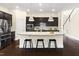 Bright kitchen boasts a large island, stainless steel appliances, and stylish pendant lighting at 204 Mill Chapel Rd, Chapel Hill, NC 27517