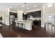 Spacious kitchen featuring dark cabinetry, a center island with bar seating, and stainless steel appliances at 204 Mill Chapel Rd, Chapel Hill, NC 27517