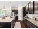 Well-appointed kitchen with granite countertops, dark cabinetry, and stainless steel appliances at 204 Mill Chapel Rd, Chapel Hill, NC 27517