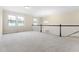 Spacious loft featuring carpet, windows and chandelier at 204 Mill Chapel Rd, Chapel Hill, NC 27517