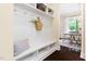 Mud room boasts white wainscoting, bench seating and storage, conveniently located near the dining room at 204 Mill Chapel Rd, Chapel Hill, NC 27517
