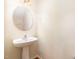Bathroom featuring a pedestal sink, modern fixtures, and neutral color scheme at 2111 Piney Brook Rd # 101, Raleigh, NC 27614
