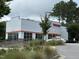 Exterior view of a Dunkin' Donuts with drive-thru for convenient coffee and pastry access at 2111 Piney Brook Rd # 101, Raleigh, NC 27614
