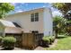 Charming home exterior featuring vinyl siding, fenced yard with mature trees, and lush green lawn at 2111 Piney Brook Rd # 101, Raleigh, NC 27614