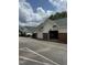 Garage row with white siding and brick accents, a white truck is seen driving by at 2111 Piney Brook Rd # 101, Raleigh, NC 27614