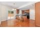Bright kitchen with wood floors, island, and access to backyard at 2111 Piney Brook Rd # 101, Raleigh, NC 27614