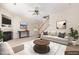 Living room showcasing a fireplace, staircase, neutral color palette, and stylish furnishings at 2111 Piney Brook Rd # 101, Raleigh, NC 27614
