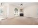 Bright living room with fireplace, lots of light and neutral decor at 2111 Piney Brook Rd # 101, Raleigh, NC 27614