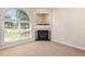 Bright living room with fireplace, lots of light and neutral decor at 2111 Piney Brook Rd # 101, Raleigh, NC 27614