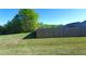 Wooden fence enclosing a well-maintained yard at 212 Placid Pond Dr, Broadway, NC 27505