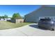 Long driveway leading to a house with an attached garage and a fenced area in the yard at 212 Placid Pond Dr, Broadway, NC 27505