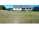 Charming single-story home with a welcoming front porch and well-maintained lawn at 212 Placid Pond Dr, Broadway, NC 27505