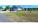 Well-kept home with an attached garage, long driveway and manicured lawn at 212 Placid Pond Dr, Broadway, NC 27505