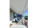 Cozy front porch featuring comfortable seating with plush blue pillows at 212 Placid Pond Dr, Broadway, NC 27505