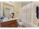 Functional bathroom with a single sink vanity, tub with shower, and essential fixtures at 2308 Buffalo Way, Durham, NC 27704