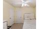 Cozy bedroom with a ceiling fan, neutral carpet and walls, providing a peaceful retreat for rest and relaxation at 2308 Buffalo Way, Durham, NC 27704