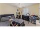 This bedroom features neutral walls, a ceiling fan, and plenty of natural light at 2308 Buffalo Way, Durham, NC 27704