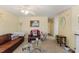 Cozy living room with comfortable seating, carpet floors, and plenty of natural light, creating a welcoming atmosphere at 2308 Buffalo Way, Durham, NC 27704