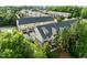 Aerial view of townhome community, with beautiful landscaping, manicured lawns, and mature trees at 2316 Apex Peakway, Apex, NC 27502