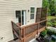 Upper level balcony showing view, wood slats, and sliding glass door for convenient indoor-outdoor living at 2316 Apex Peakway, Apex, NC 27502