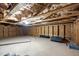 Unfinished basement with insulation and exposed wood beams awaits your creative vision and design at 2316 Apex Peakway, Apex, NC 27502