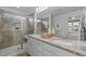 Bright bathroom with a glass shower, granite counters, double sinks and lots of cabinet space at 2316 Apex Peakway, Apex, NC 27502
