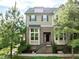 Charming two-story home with brick facade, landscaped yard, and inviting front entrance at 2316 Apex Peakway, Apex, NC 27502