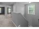 Upstairs hallway with staircase and window at 2316 Apex Peakway, Apex, NC 27502