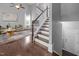 Bright living room with hardwood floors, vaulted ceiling, elegant staircase and natural light at 2316 Apex Peakway, Apex, NC 27502