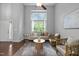 Comfortable living room with stylish decor, hardwood floors, and ample natural light at 2316 Apex Peakway, Apex, NC 27502