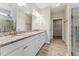 Bathroom with granite countertop vanity, tile floor, and a large mirror at 233 Theys Mill Way, Fuquay Varina, NC 27526