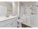 Bathroom with white vanity, toilet, and a walk-in tub with shower fixture at 233 Theys Mill Way, Fuquay Varina, NC 27526