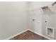 Laundry room featuring tile floor, wire shelf, and hookups for the washer and dryer at 233 Theys Mill Way, Fuquay Varina, NC 27526