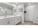 Modern bathroom features double sinks, a large mirror, and updated fixtures at 239 Moyer Dr, Graham, NC 27253