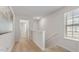 Bright hallway with carpeted floors leading to additional rooms at 239 Moyer Dr, Graham, NC 27253