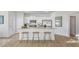 Modern kitchen boasting white cabinets, granite countertops, and stainless steel appliances at 239 Moyer Dr, Graham, NC 27253