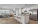 Modern kitchen boasting white cabinets, granite countertops, and stainless steel appliances at 239 Moyer Dr, Graham, NC 27253