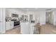 Modern kitchen with a breakfast bar, white cabinets, and stainless steel appliances at 239 Moyer Dr, Graham, NC 27253