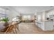 Open-concept living area with dining space, stylish furnishings, and a breakfast bar at 239 Moyer Dr, Graham, NC 27253