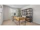 Bright home office with a modern desk, stylish shelving, and ample natural light at 239 Moyer Dr, Graham, NC 27253