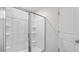 The shower is glass-enclosed and features built-in shelving for convenience at 239 Moyer Dr, Graham, NC 27253