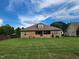 Wide view of the backyard showing lawn space and the exterior of the home at 243 Nortwick Rd, Rolesville, NC 27571