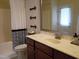 Bathroom features modern vanity, white tub and toilet at 243 Nortwick Rd, Rolesville, NC 27571