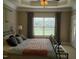 Bedroom featuring a spacious layout with a large window and view of the backyard at 243 Nortwick Rd, Rolesville, NC 27571