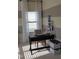 Neutral room with decorative shelf and a desk area with natural light from the window at 243 Nortwick Rd, Rolesville, NC 27571