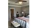 Bedroom featuring a ceiling fan, tray ceiling, and neutral decor, creating a relaxing atmosphere at 243 Nortwick Rd, Rolesville, NC 27571