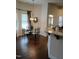 Cozy dining area features natural light, chandelier and wood floors at 243 Nortwick Rd, Rolesville, NC 27571