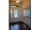 Beautiful foyer with gleaming hardwood floors and decorative glass door at 243 Nortwick Rd, Rolesville, NC 27571