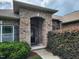 Inviting brick entryway featuring a covered porch and manicured landscaping at 243 Nortwick Rd, Rolesville, NC 27571