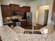 Modern kitchen with stainless appliances, granite countertops, and a convenient layout at 243 Nortwick Rd, Rolesville, NC 27571